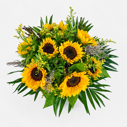 Overhead view of the Helios Bouquet with yellow sunflowers, delicate filler flowers and green foliage.